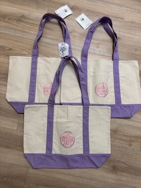 3 large purple Trader Joe’s tote bags